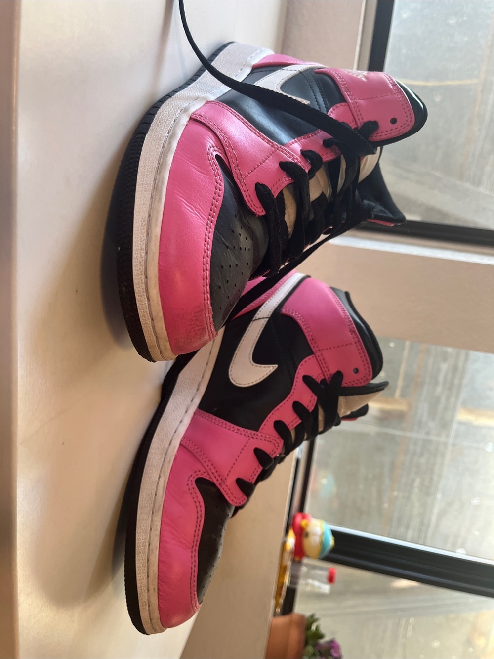 Pink and Black Low-Top Sneakers with White Swoosh